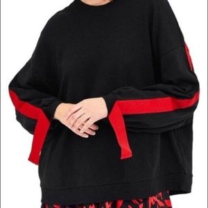 zara sweatshirt with red ribbon along the back